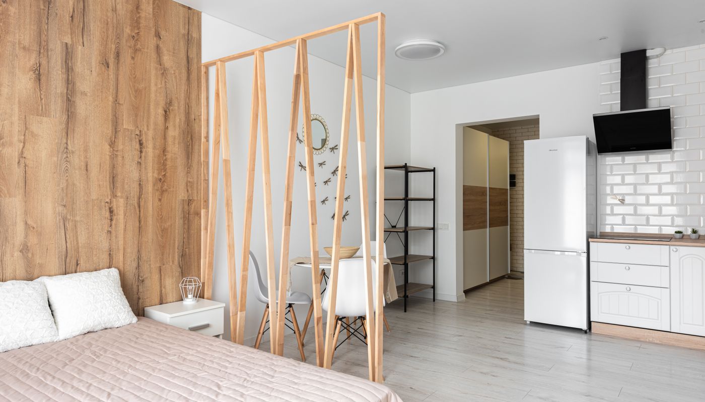 Layered ambient and task lighting in a modern apartment interior