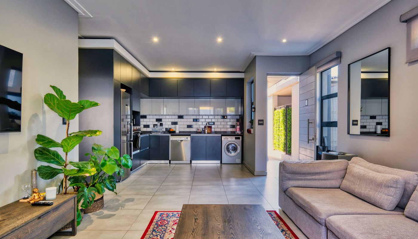 Modern open kitchen with clear circulation and organised cabinets